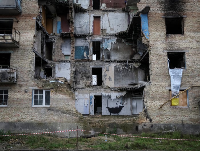 A Banksy mural on a war-damaged building in Ukraine.
