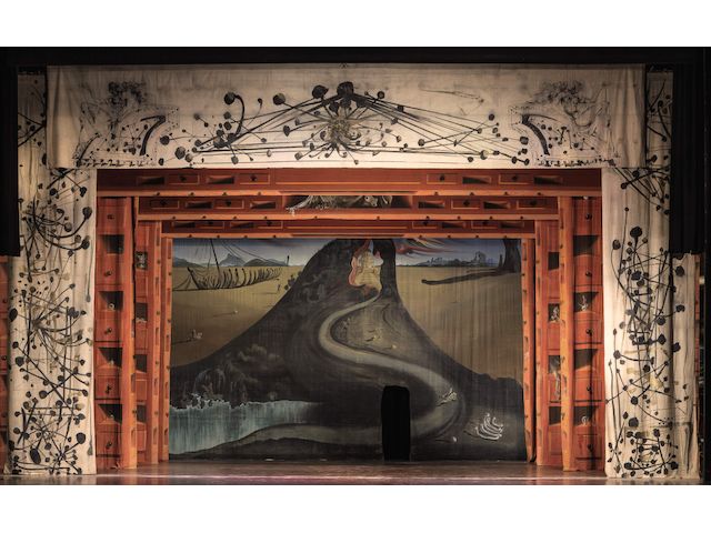 Monumental multi-panel stage design by Salvador Dalí displayed as a large installation.