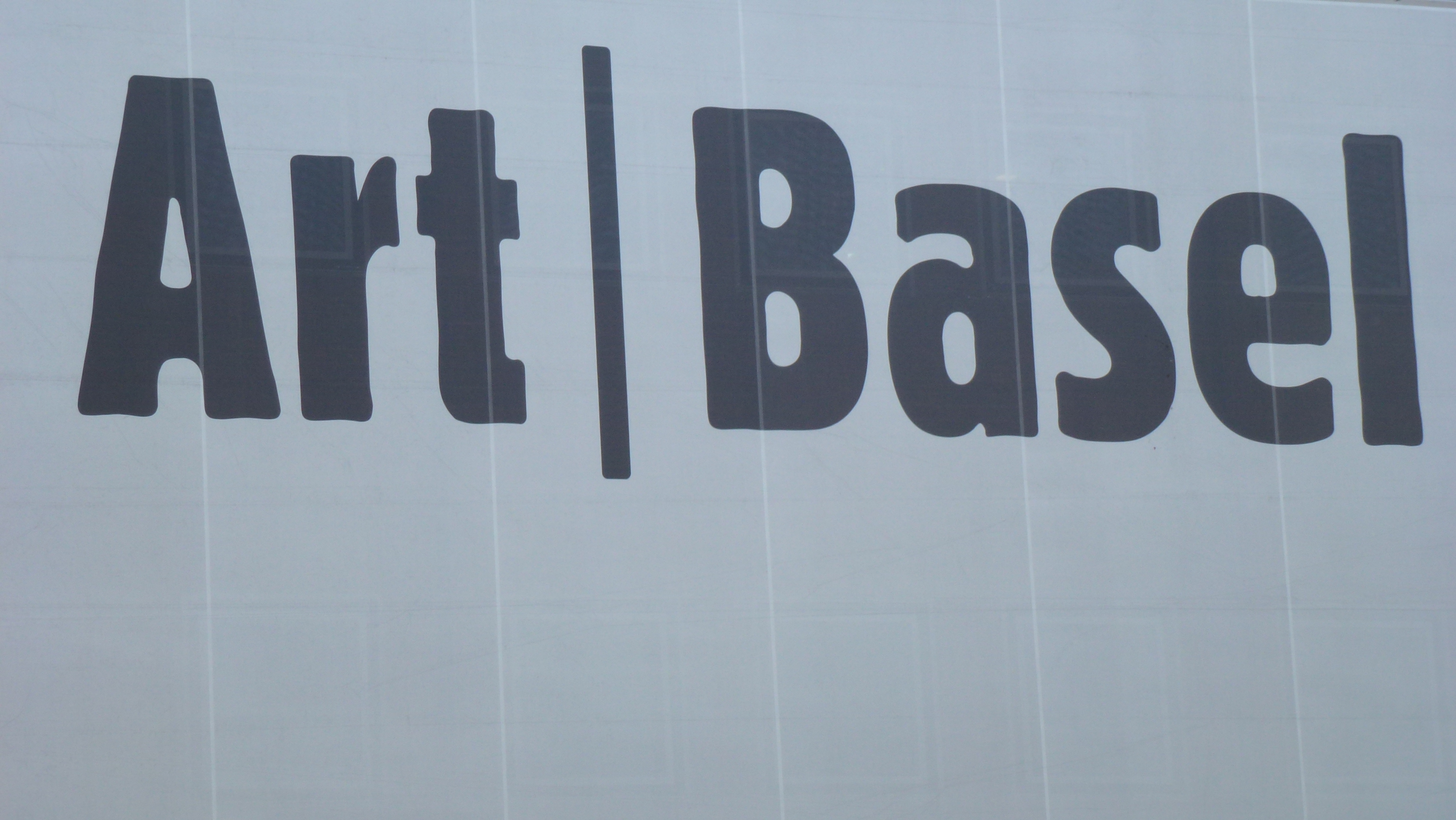 Visitors at Art Basel, reflecting the fair based global art market