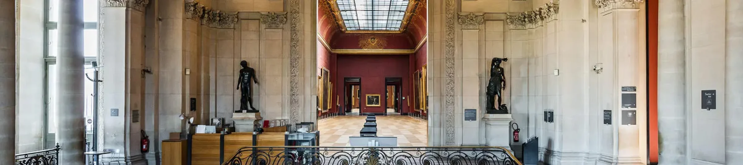 Interior staircase and gallery architecture inside the Louvre museum complex.