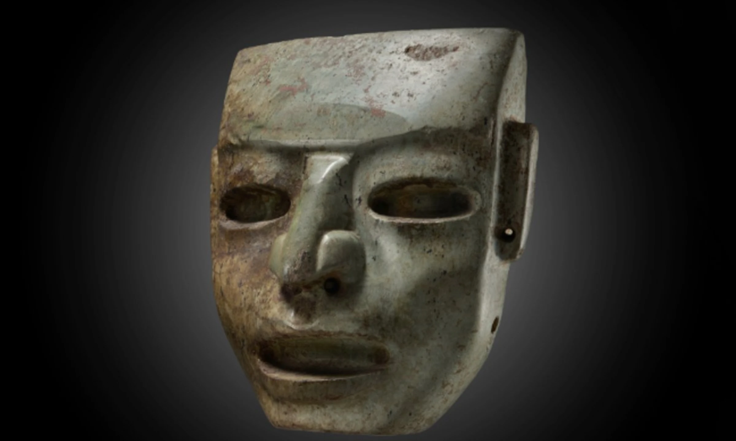 A pre-Columbian Teotihuacán stone mask photographed for Sotheby's sale catalogue
