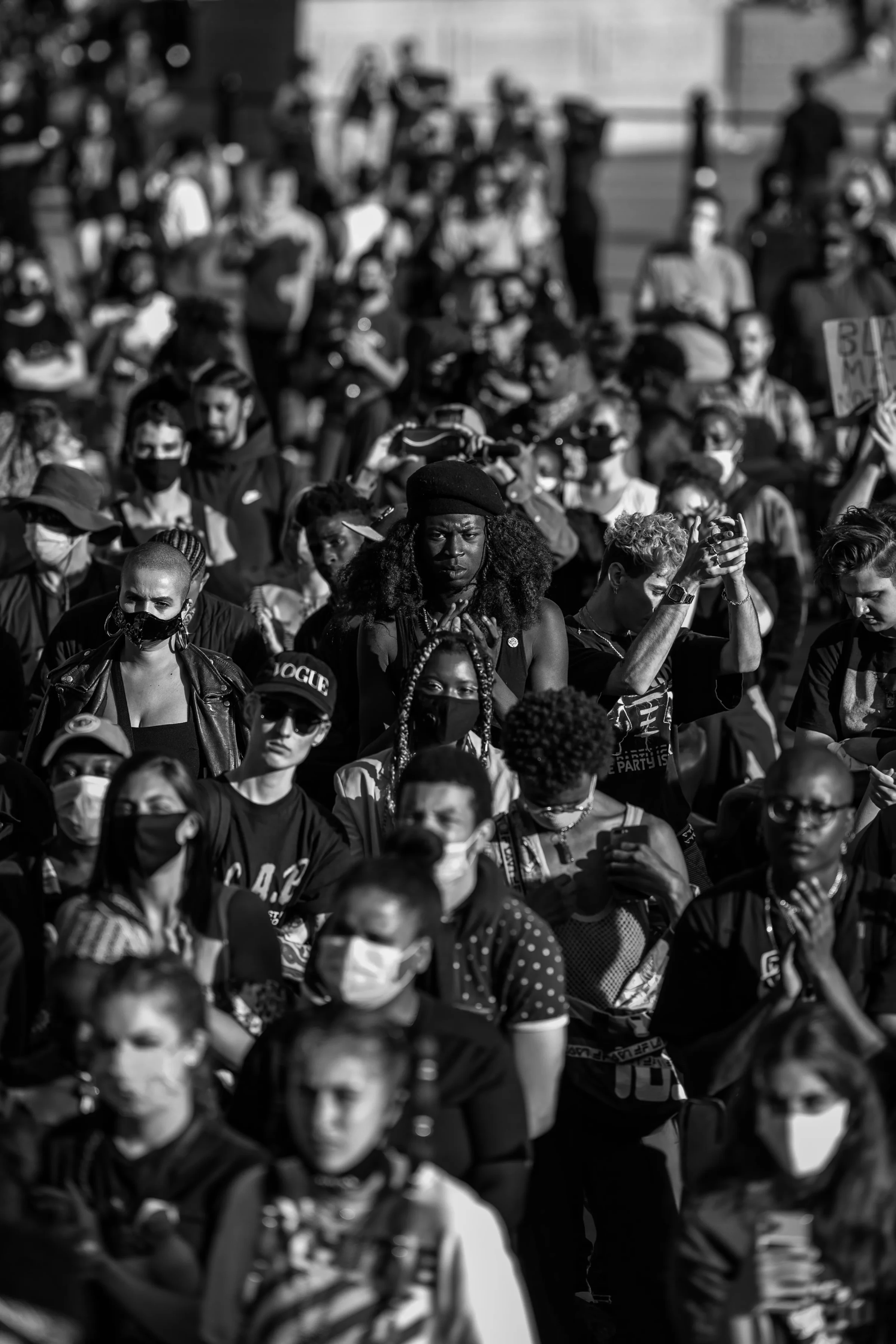 Participants hold a Black Trans Lives Matter sign in Misan Harriman’s black-and-white protest photograph.