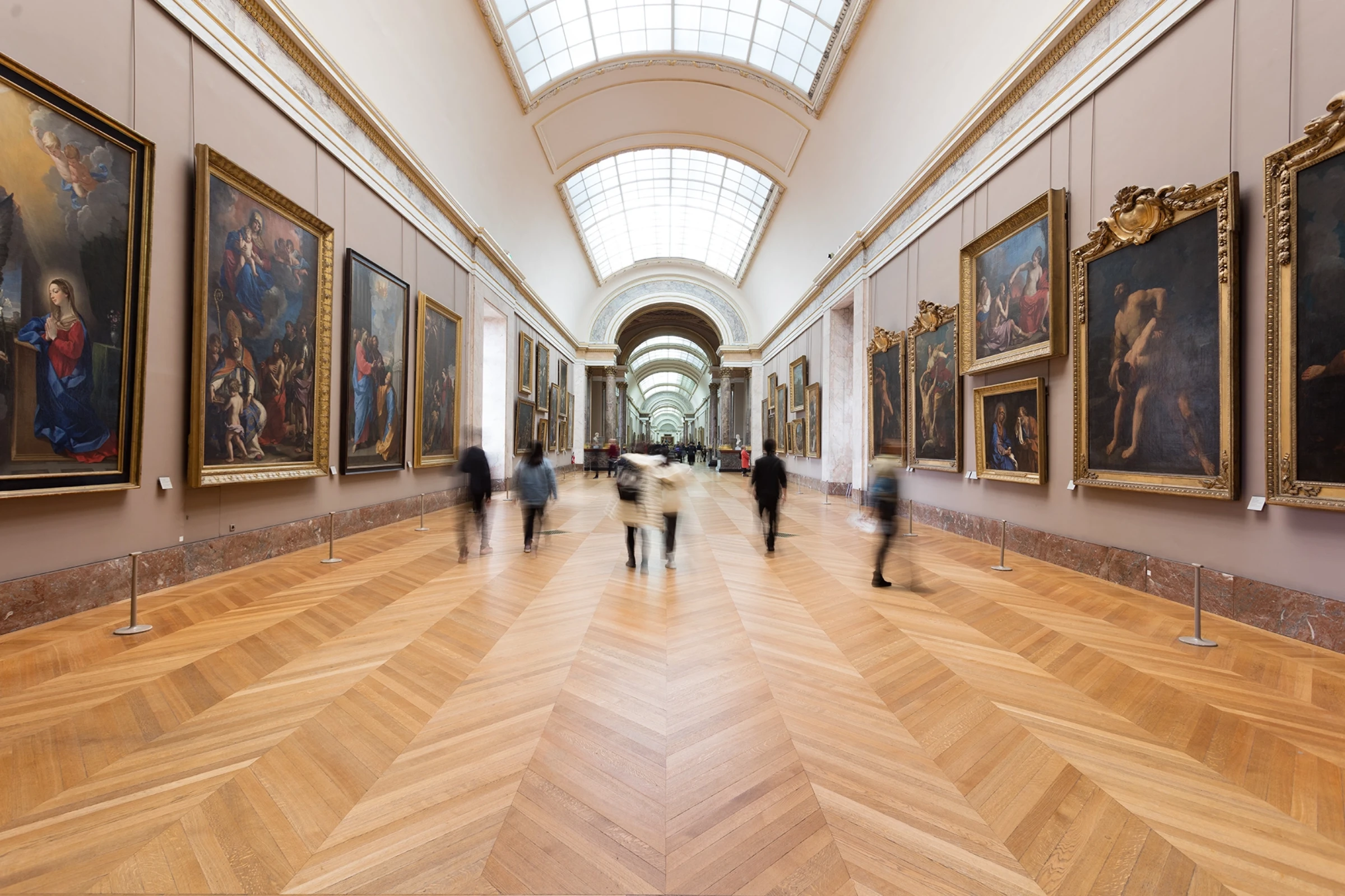 Interior view of a grand museum gallery.