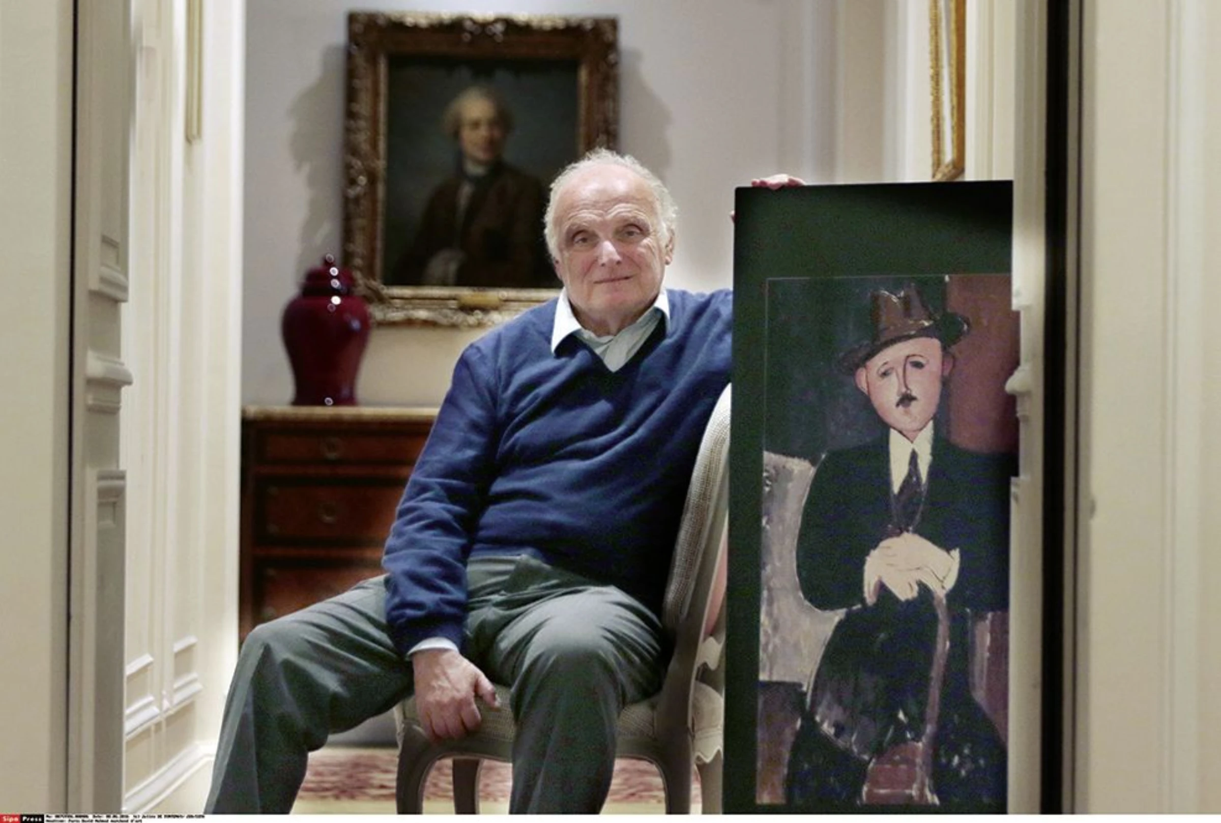 Amedeo Modigliani painting Seated Man With a Cane in a neutral gallery presentation.