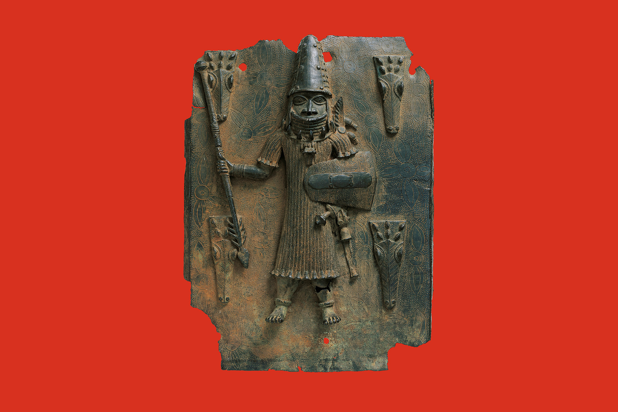 Benin objects displayed in a museum exhibition context, emphasizing provenance and restitution research.