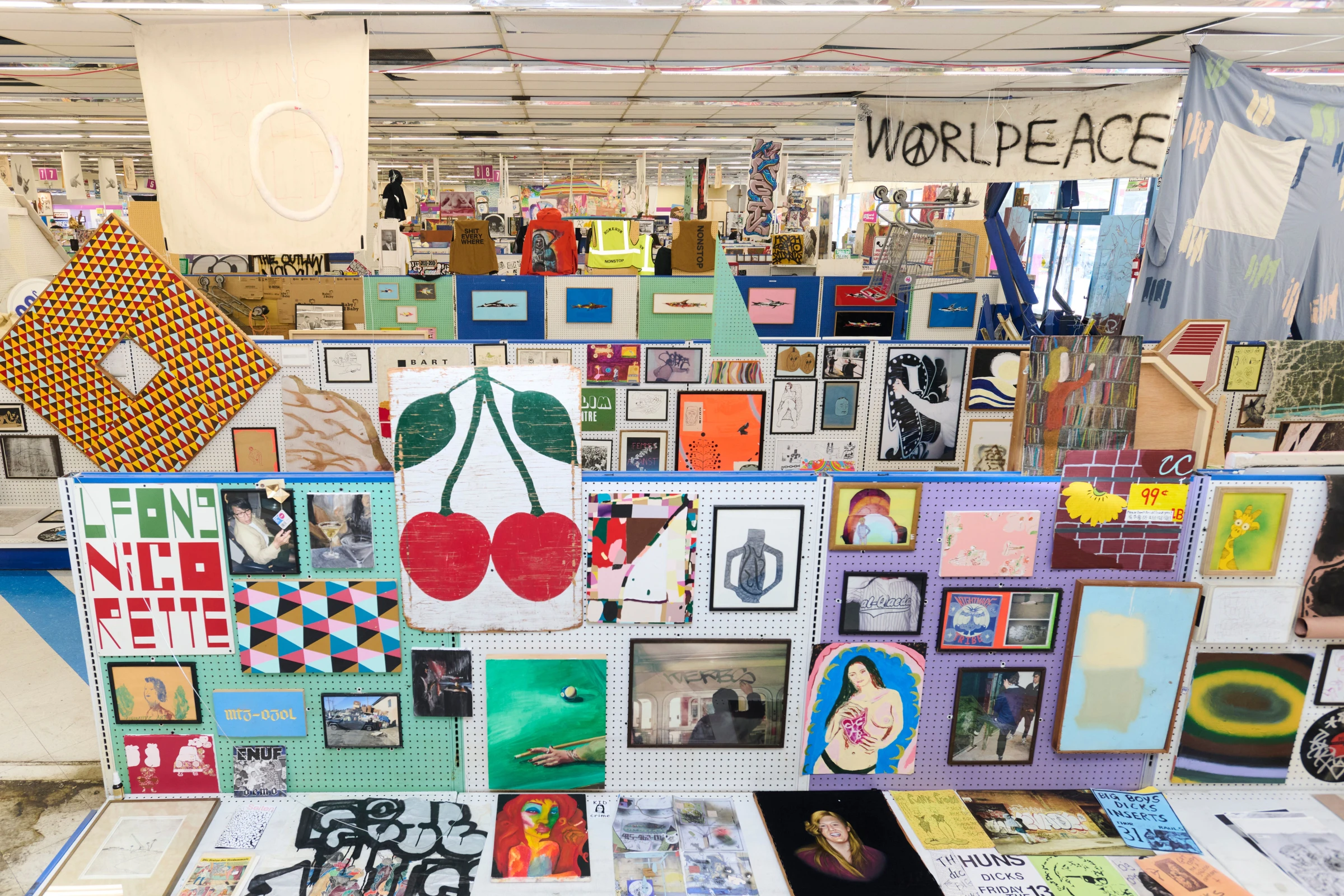 Crowded interior installation view associated with The Hole during Los Angeles art week.