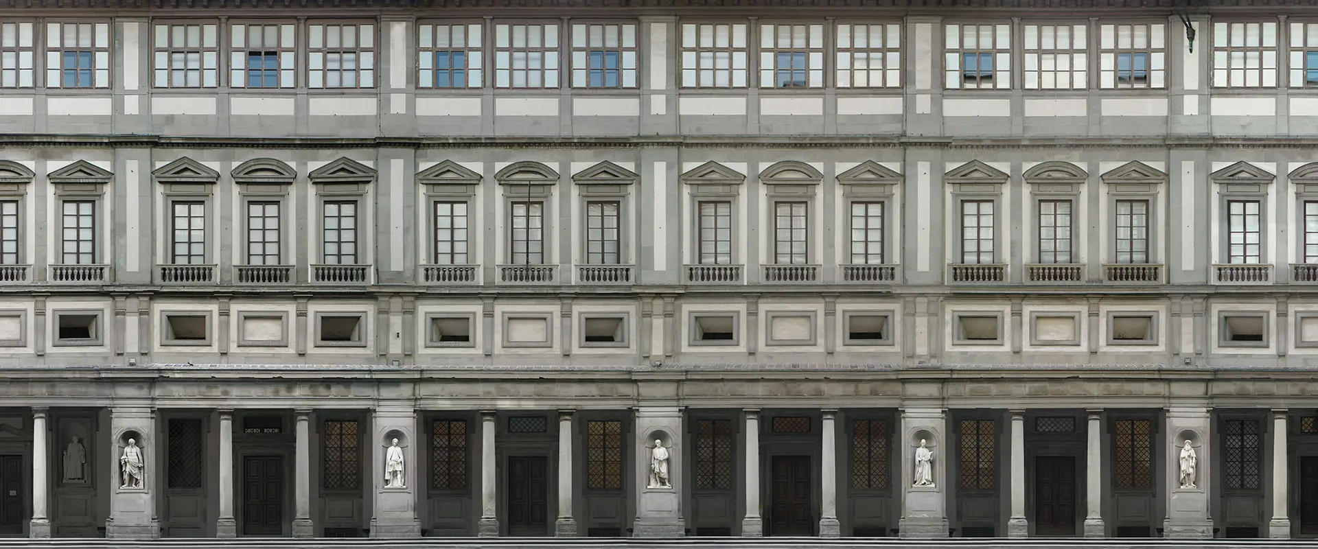 Facade and courtyard perspective of the Uffizi Galleries in Florence.