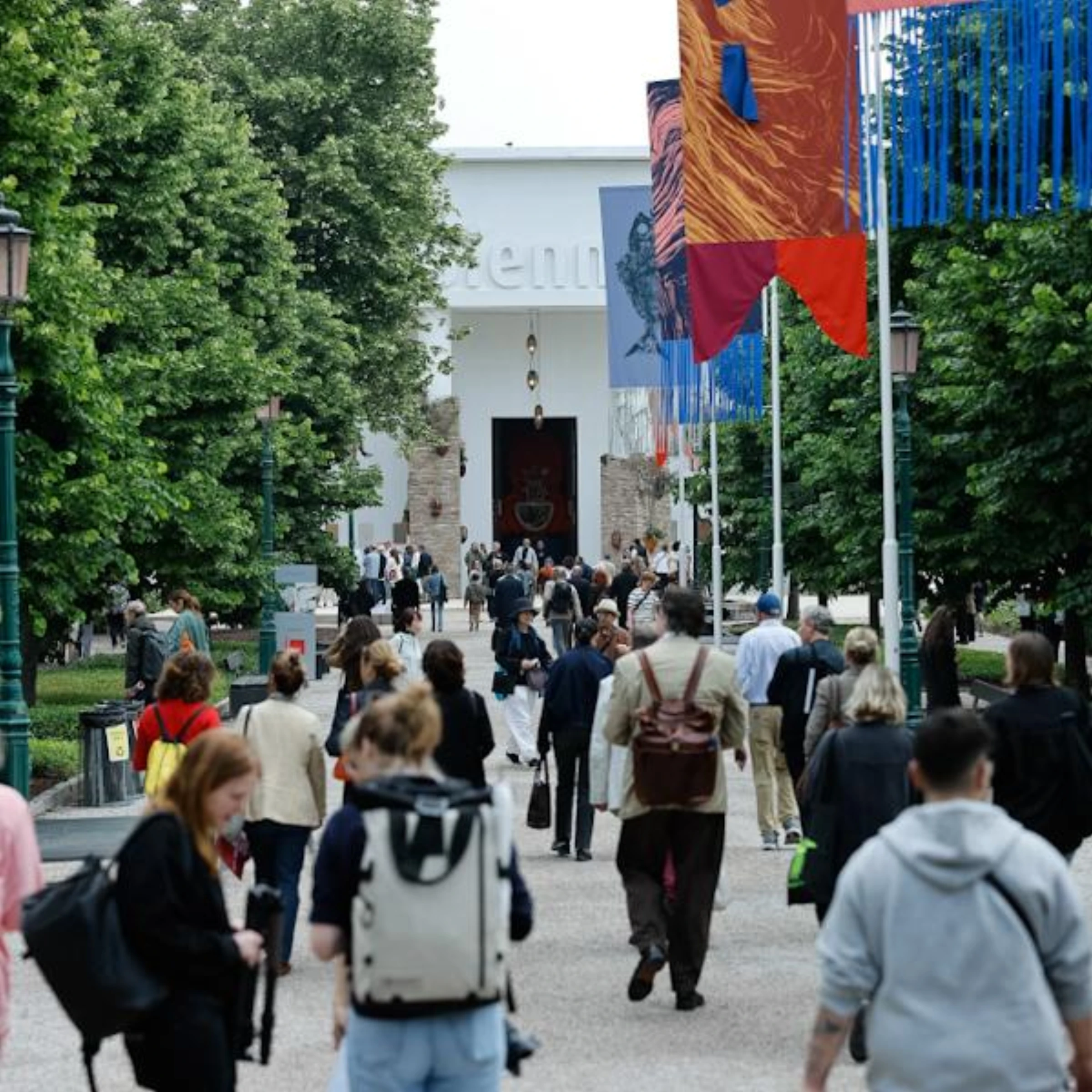 Visitors gathered at the 2026 Venice Biennale in a courtyard during the exhibition