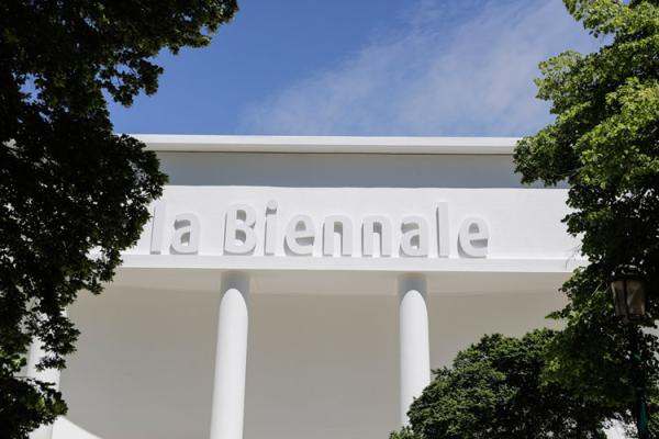 Interior view of the renovated Central Pavilion at the Giardini with white galleries and exposed trusses