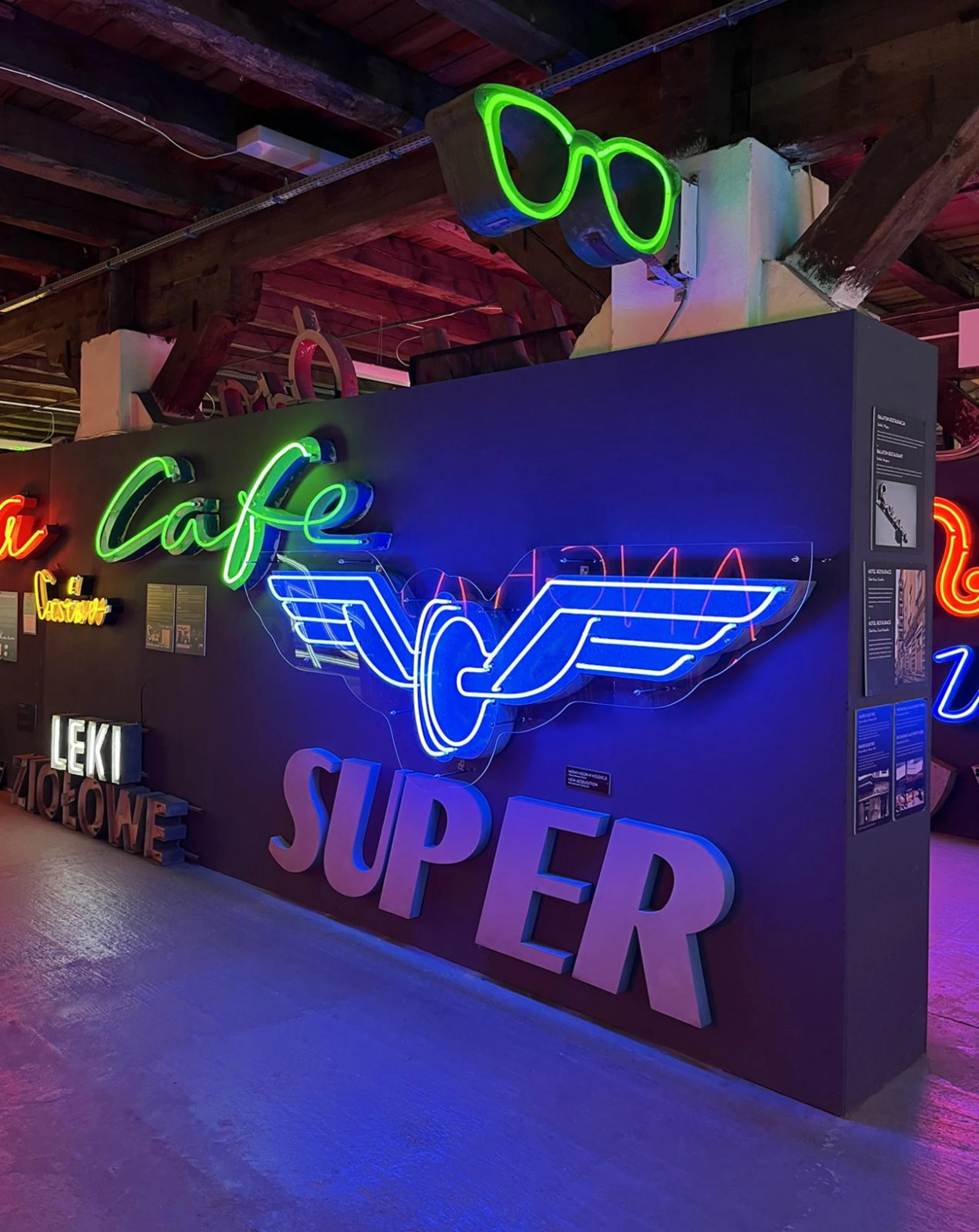 Historic neon wing sign preserved by Warsaw's Neon Museum.